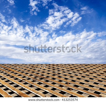 wooden floor blue sky with clouds