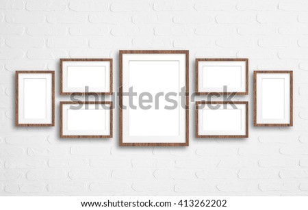 Blank photo frames collage on bricks wall, interior mock up