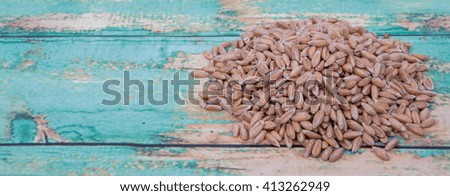 Wheat grain over wooden background
