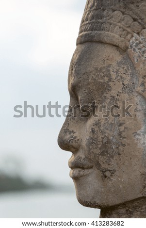 Sculpture of face at the entrance of Bayon Temple, Angkor Wat, Cambodia 2016