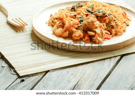 Instant noodles, fried pork, and vegetables