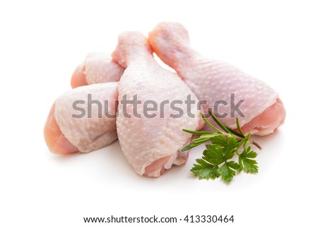 Raw chicken legs on white background isolated Royalty-Free Stock Photo #413330464