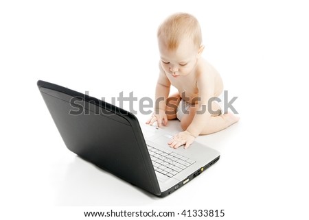 Infant using laptop over white