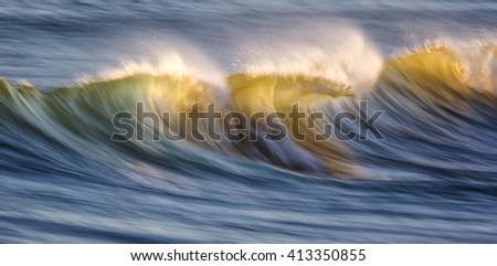 Waves on the ocean captured with a slow shutter speed to bring a sense of movement and power.