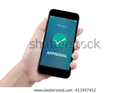 Hand holding mobile smart phone with project approved screen on white background, isolated Royalty-Free Stock Photo #413397412