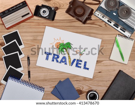Paper with drawing travel concept. Old retro object on wooden table