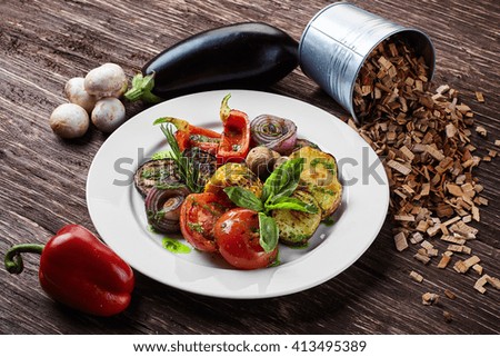 vegan grilled vegetables on a wooden background