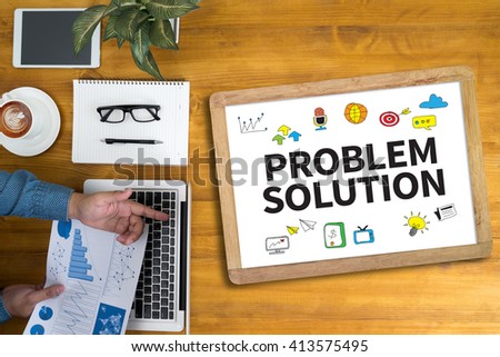 PROBLEM SOLUTION Businessman working at office desk and using computer and objects, coffee, top view,