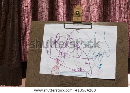 Child's drawings on sketch board