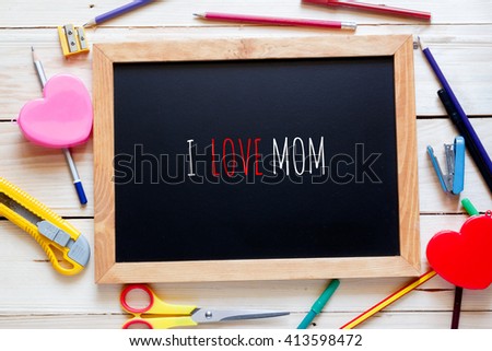 Mothers day composition.Blackboard on wood 