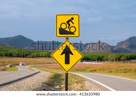 Bike lane with Road signs direct and Downhill Slope signs