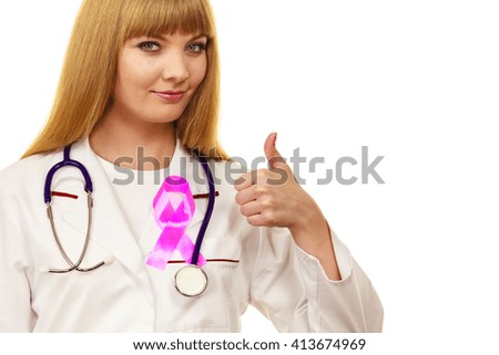 Woman doctor with stethoscope and pink ribbon aids symbol on chest making thumb up gesture. Healthcare, medicine breast cancer awareness concept. 