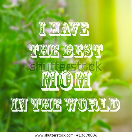 Spring blurred background with blossom flower and text Mother`s Day
