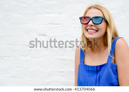 Exciting beautiful young woman watching movie with 3D glasses, joyful looking forward. Closeup portrait