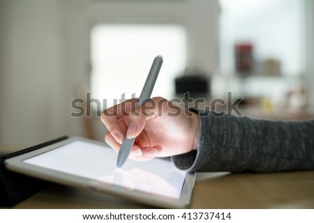 Woman using tablet to design