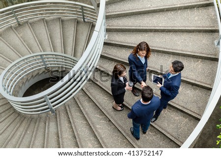 Top view of business people standing at the steps