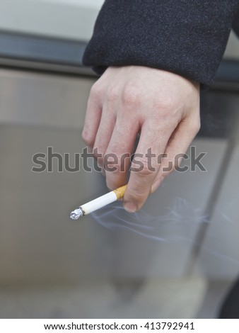 Man smoking in public, New York City, USA