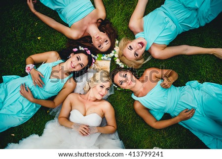 Beautiful girls lay on the grass Royalty-Free Stock Photo #413799241