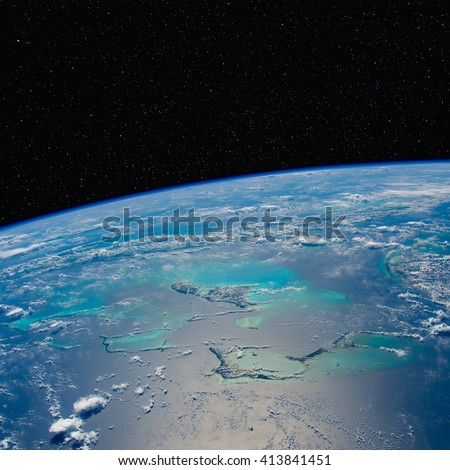 Caribbean seascape from space with stars above. Elements of this image furnished by NASA.