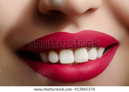 Beautiful smile with whitening teeth. Dental photo. Perfect fashion lips makeup. Health happy female smile. Macro close-up shot of woman's mouth. Care about tooth
