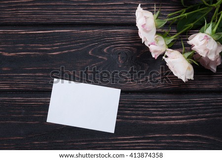 Fresh rose on wooden boards. Greeting card