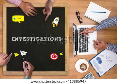 INVESTIGATIONS CONCEPT        Businessman working at office desk and using computer and objects on the right, coffee,  top view, with copy space