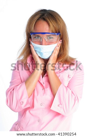 Young dentist in a mask and protective glasses. Isolated