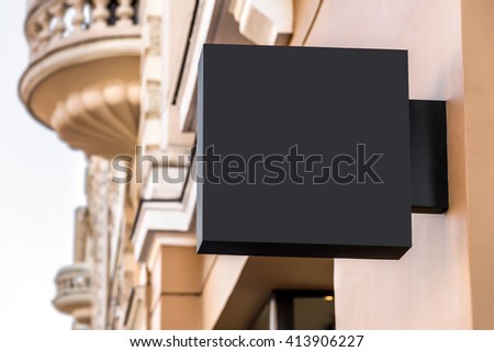 Mock up of restaurant black signboard on yellow wall