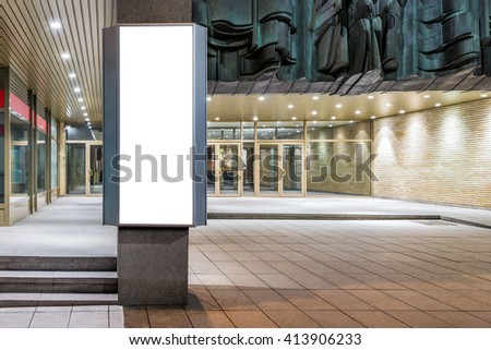 Mock up of vertical lightbox in city space at night