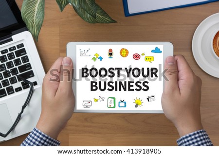 BOOST YOUR BUSINESS man hand Tablet and coffee cup