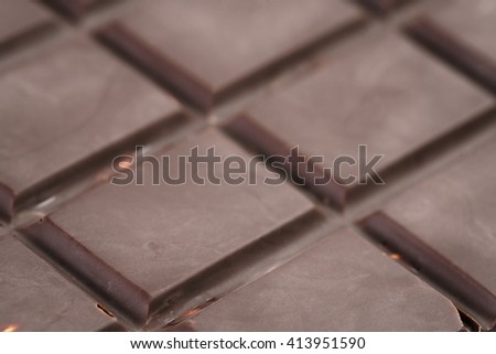 dark chocolate bar closeup photo, shallow focus