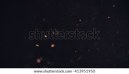 orange particles like spark slowly float in air, 4k photo Royalty-Free Stock Photo #413951950
