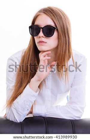 Cute blonde keeps the sunglasses in the Studio on a white background. Insulation.
