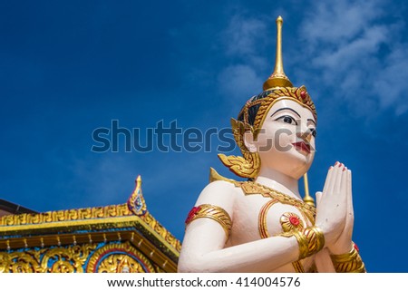 Buddha statue in front of temple usefor input text in fram picture.