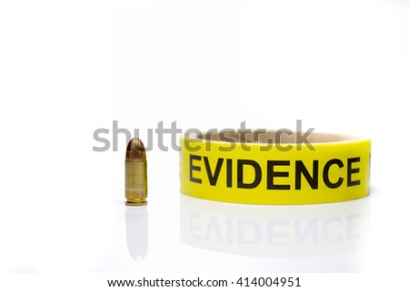 evidence tape with 9 mm bullet  on white background