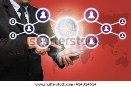 Businessman using the smart phone with the Social media symbol on red color background with world map, Elements of this image furnished by NASA, Business network concept