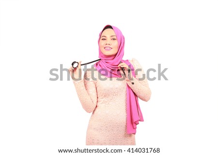 Front view of a pretty doctor woman showing stethoscope