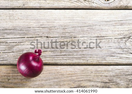 spanish onion on old rustic wood table background