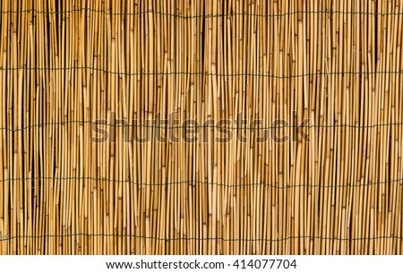 Hay or dry grass background / Thatch roof for background / dried straw or cane Royalty-Free Stock Photo #414077704