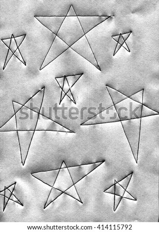 Five-pointed star drawn on paper in black and gray. Form the star has five ends. The stars have different sizes, mainly used in geometry.