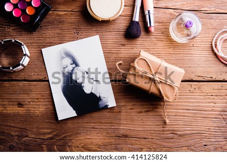 Mothers day composition. Photo, package and make up products.