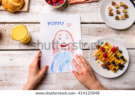 Childs drawing of her mom. Mothers day. Breakfast meal.