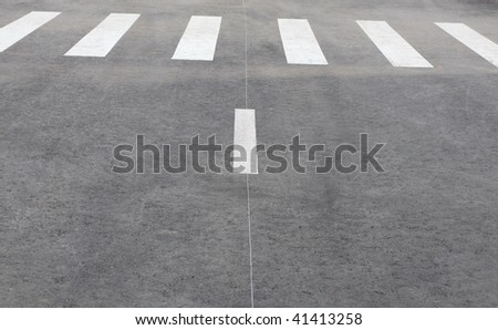 pedestrian crossing on road at day