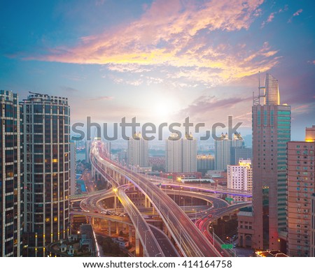 Aerial photography at city elevated bridge of sunrise pink clouds