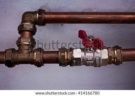 Pipe with bands and manual heat control. Royalty-Free Stock Photo #414166780