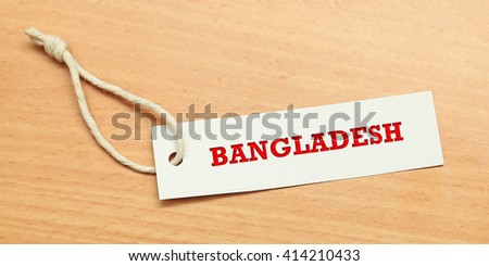 White tag on wooden background with word Bangladesh