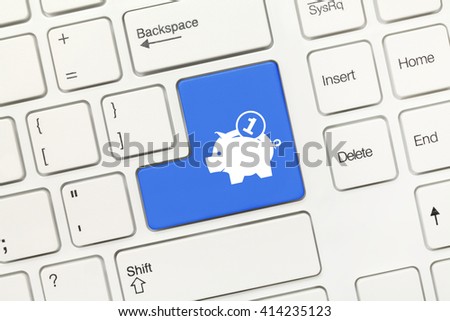 Close-up view on white conceptual keyboard - Blue key with moneybox symbol