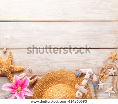 Beach accessories on wooden background