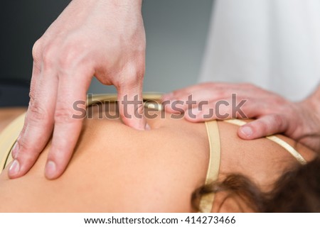 Trigger point physical therapy Royalty-Free Stock Photo #414273466