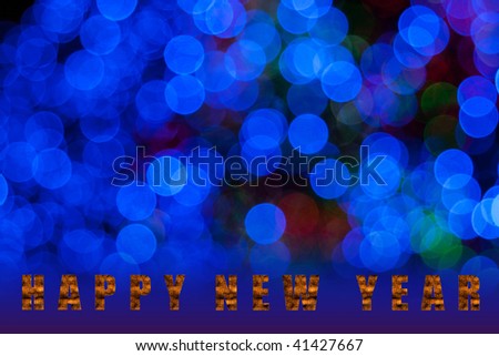 Text Happy New Year on unfocused  Blue holiday background.(clipping path)